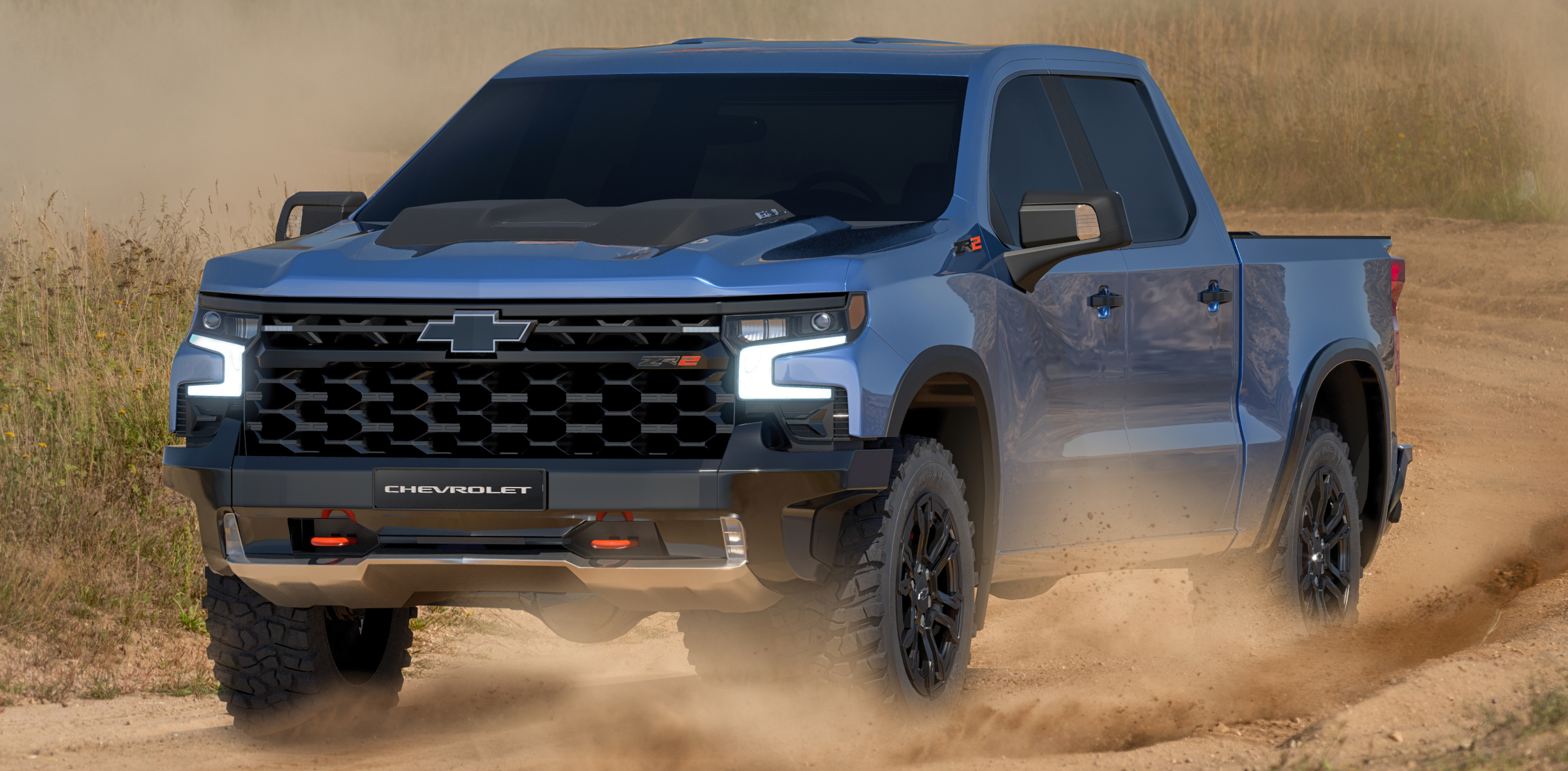A 2022 Chevy Silverado racing down a dirt road.