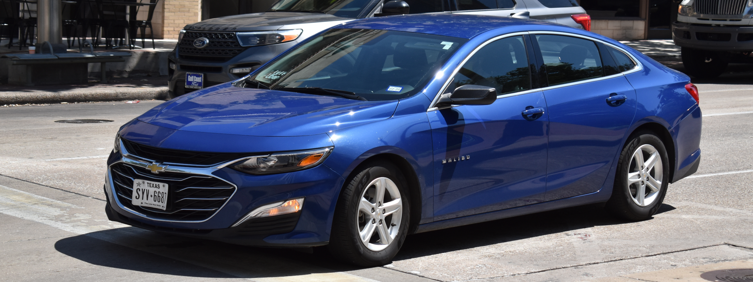 A blue Chevrolet Malibu vehicle