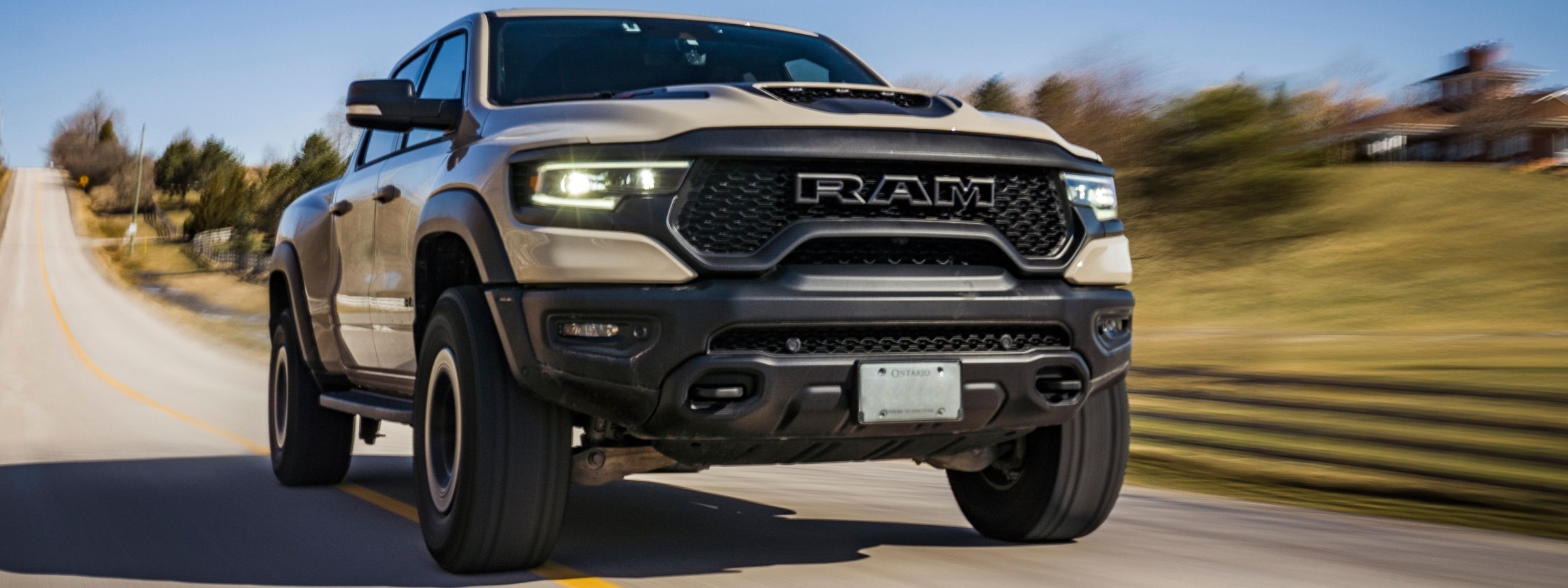 Ram 1500 driving down a freeway