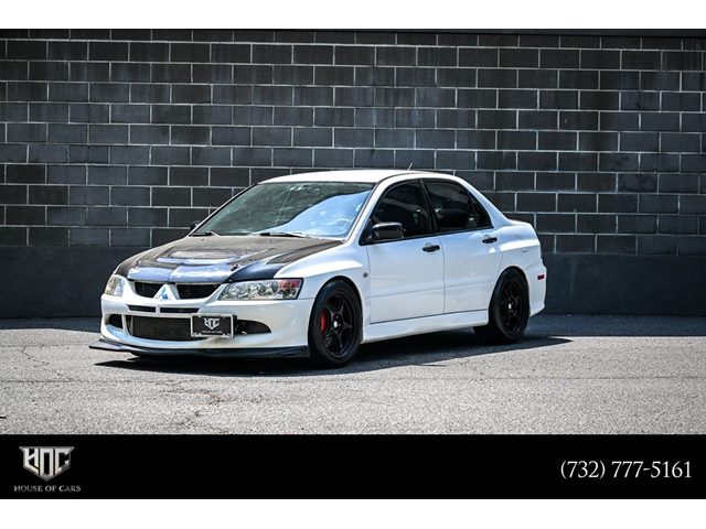 Weightless White 2004 Mitsubishi Lancer Evolution RS Sedan All-Wheel Drive Manual