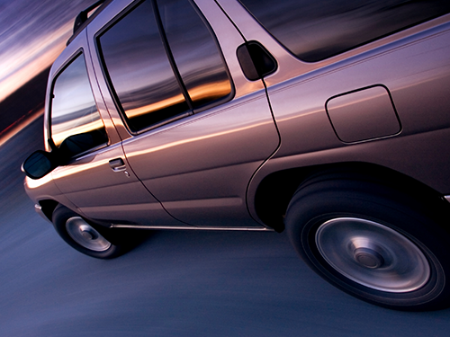 A vehicle going down a road