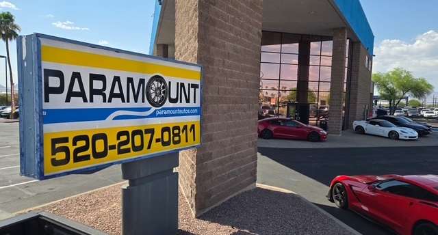 Paramount Auto Sales street sign at the Tucson dealership on E Valencia Rd