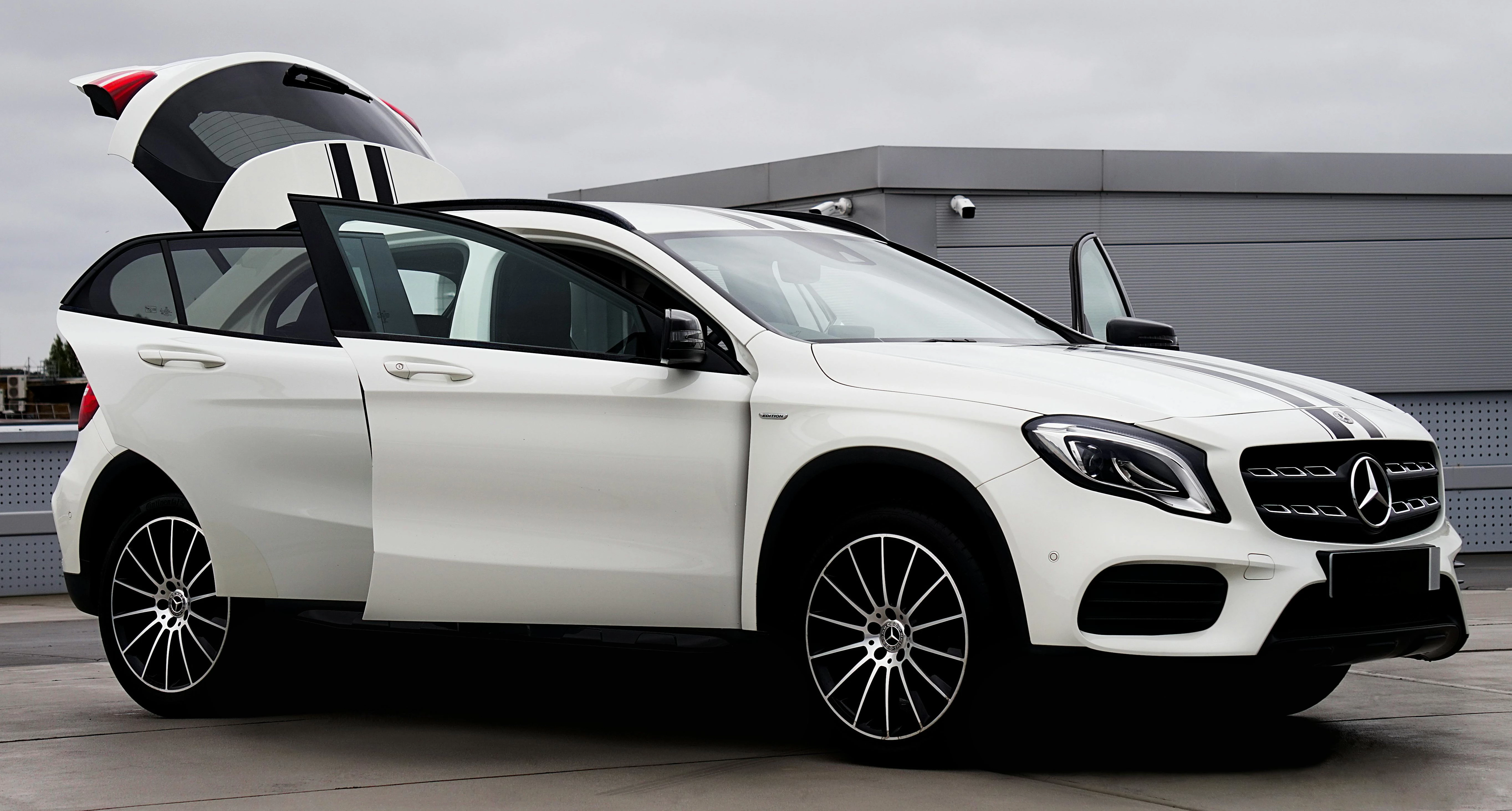 A Mercedes-Benz SUV open for inspection.