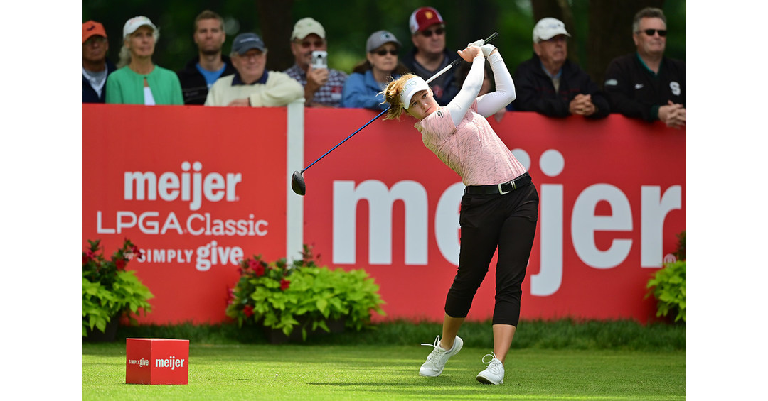 Woman taking a golf swing at the LPGA Meijer Classic