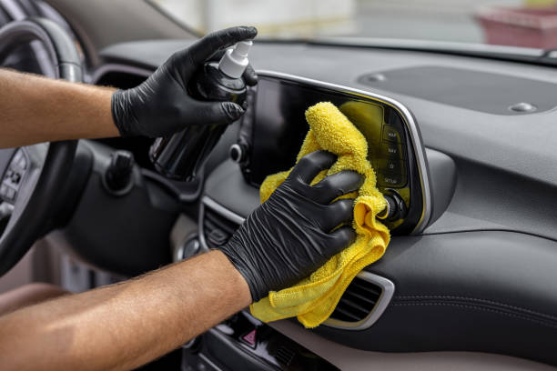 Detail cleaning your luxury car's dashboard display.