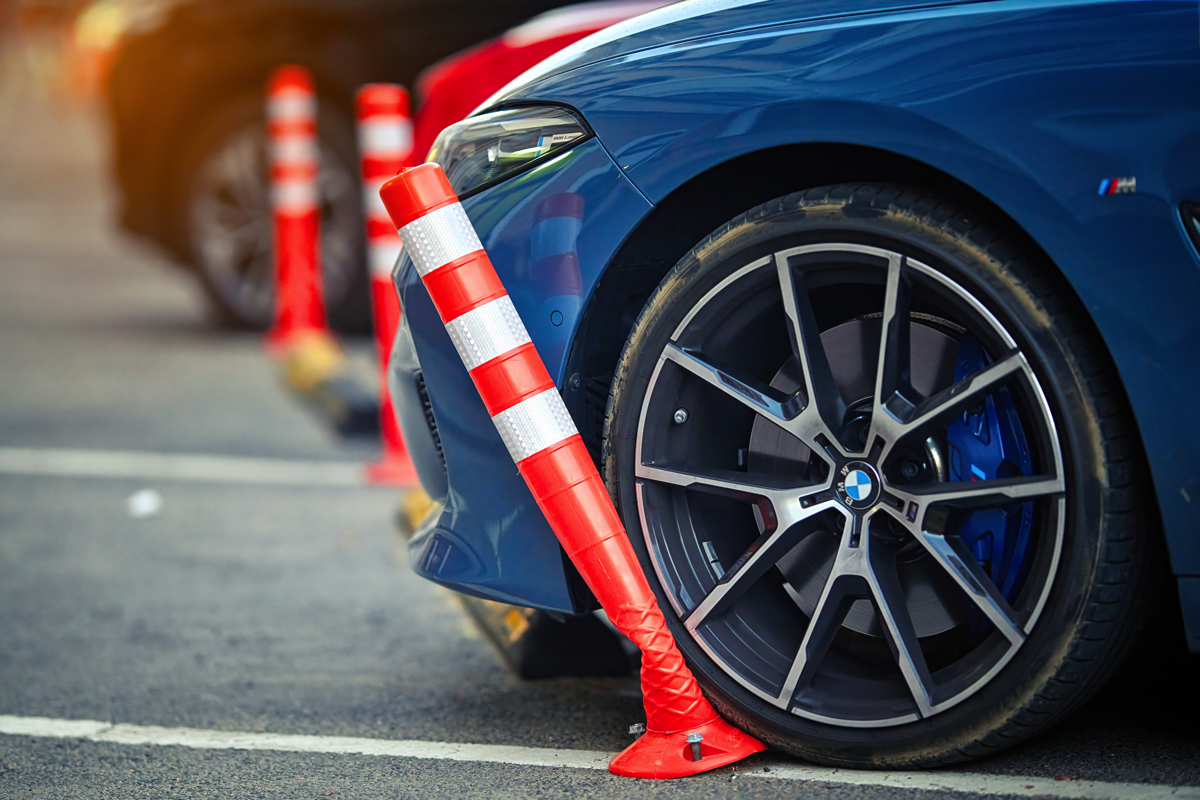 A Bemer Motors technician inspecting a BMW.