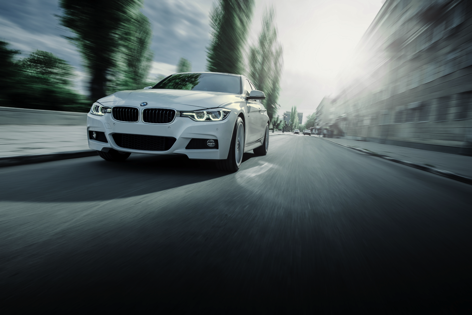 A BMW racing down a street.