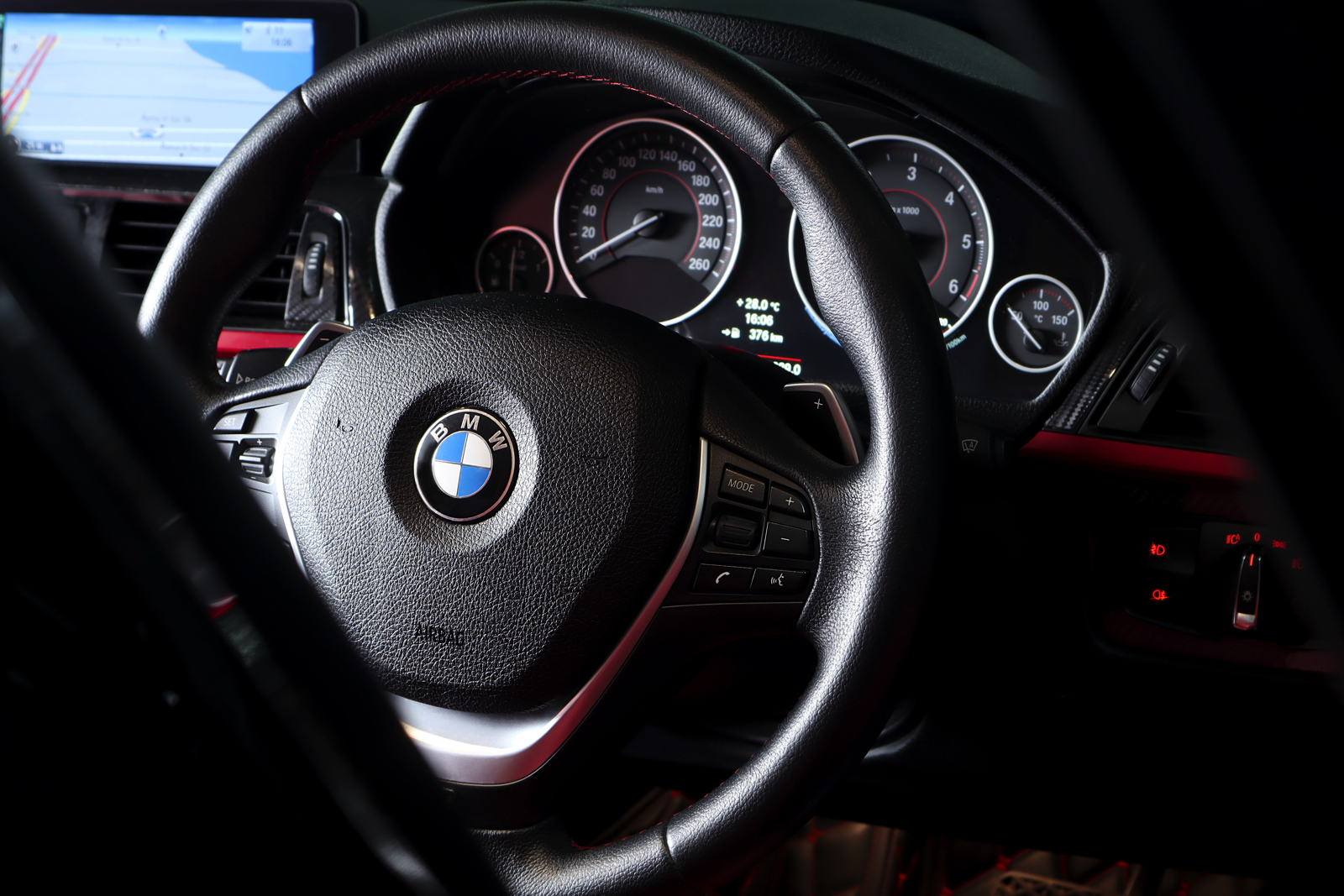 A BMW racing down a street.