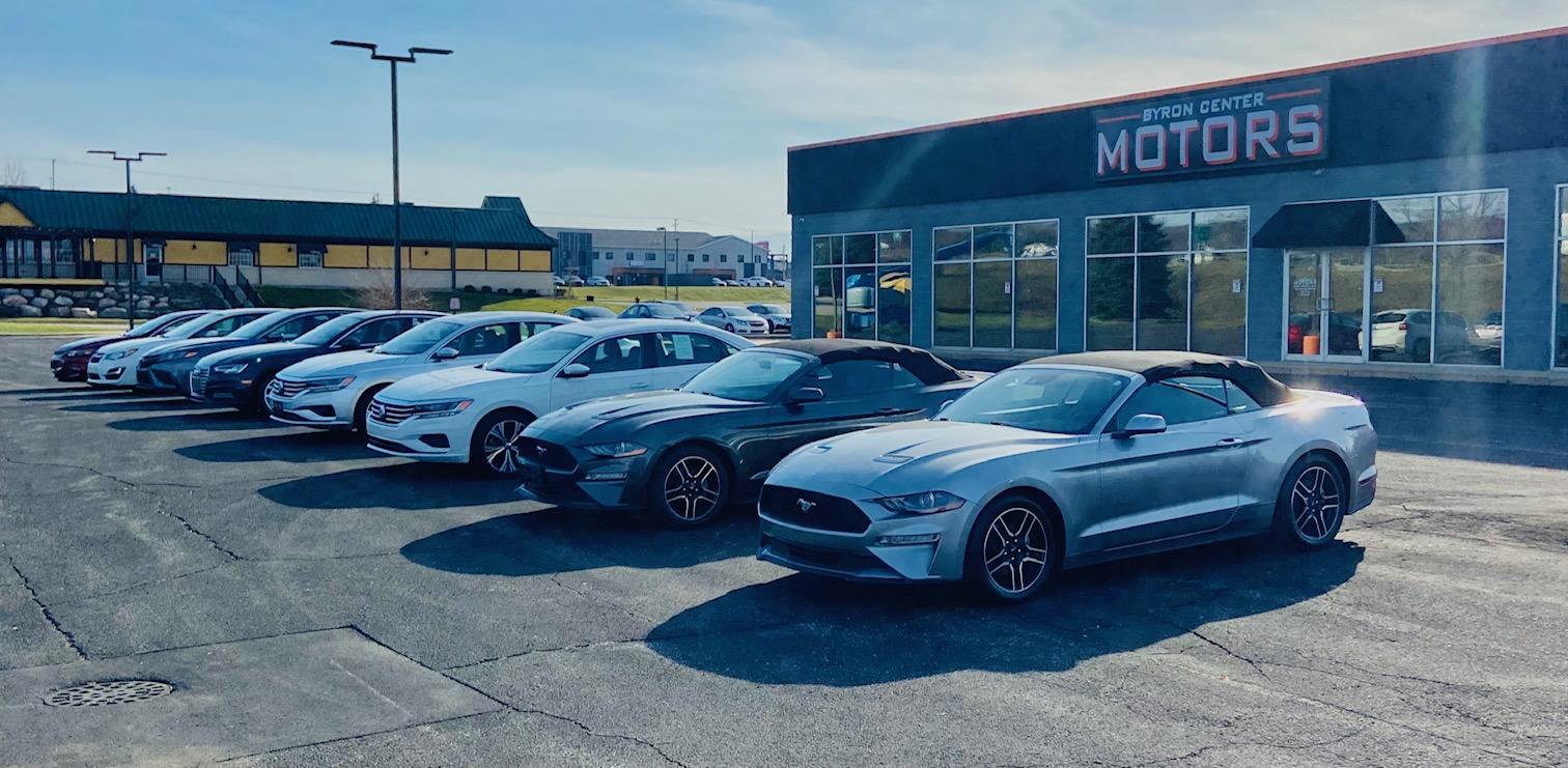 Sedans parked upfront at Byron Center Motors used car dealership in Byron Center MI