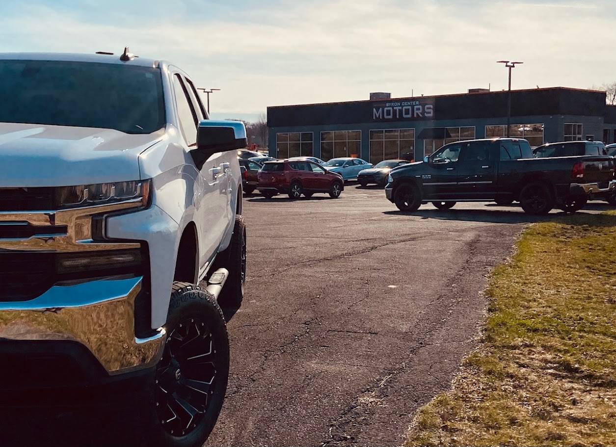 Trucks parked outside at Byron Center Motors used car dealership in Byron Center MI