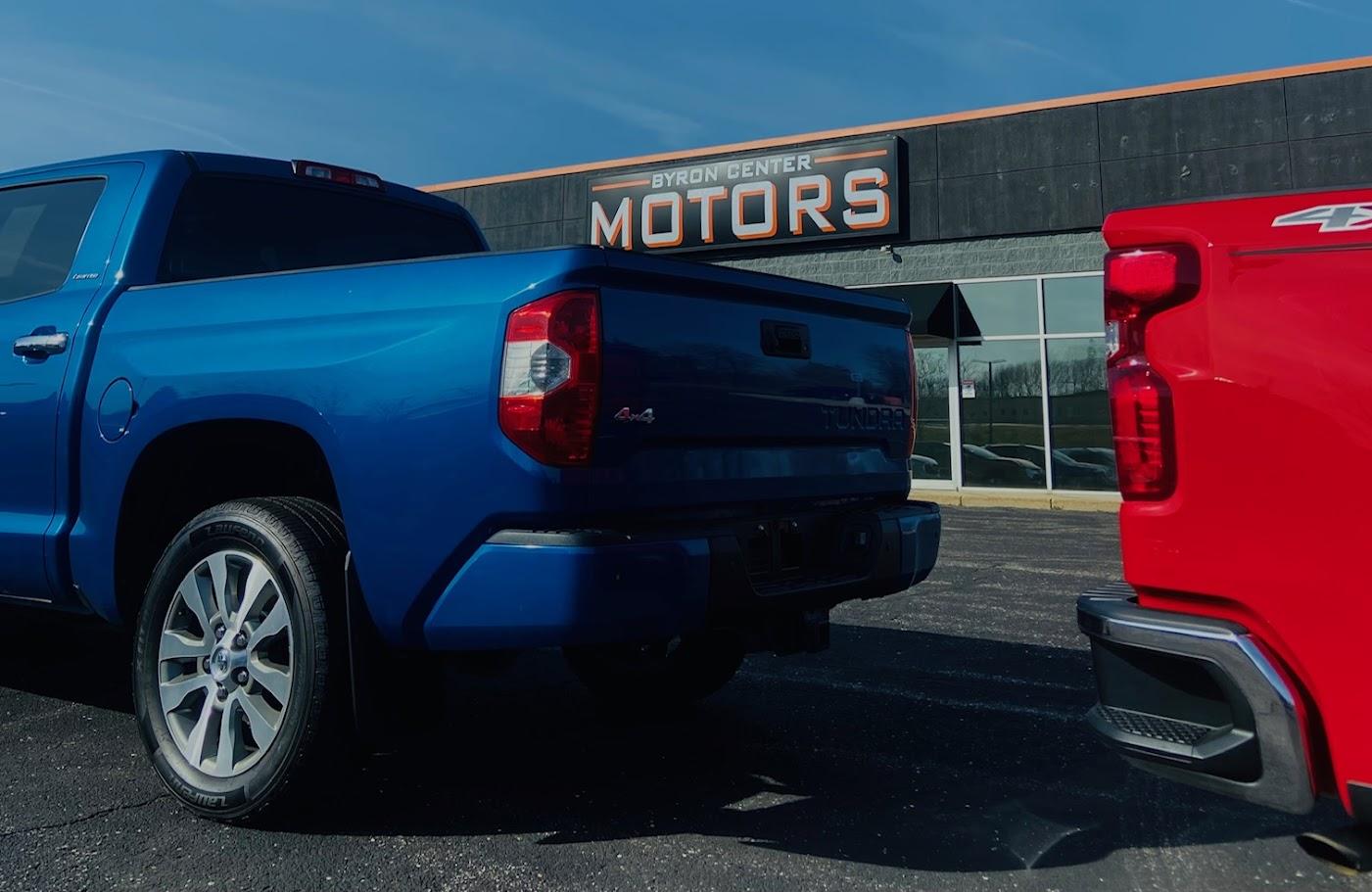 Red and blue truck for sale at Byron Center Motors used car dealership in Byron Center MI